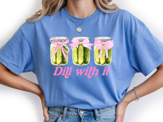 Person wearing blue unisex pickle t shirt with “Dill With It” quote and cute pickle jar design
