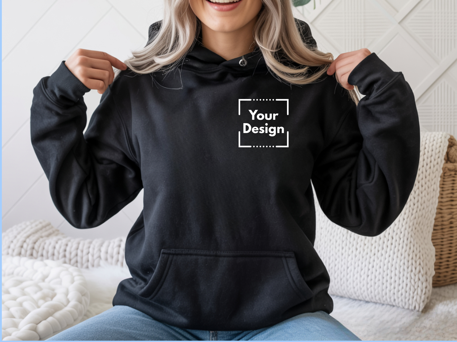 A black hoodie with “your design” text on the front corner.