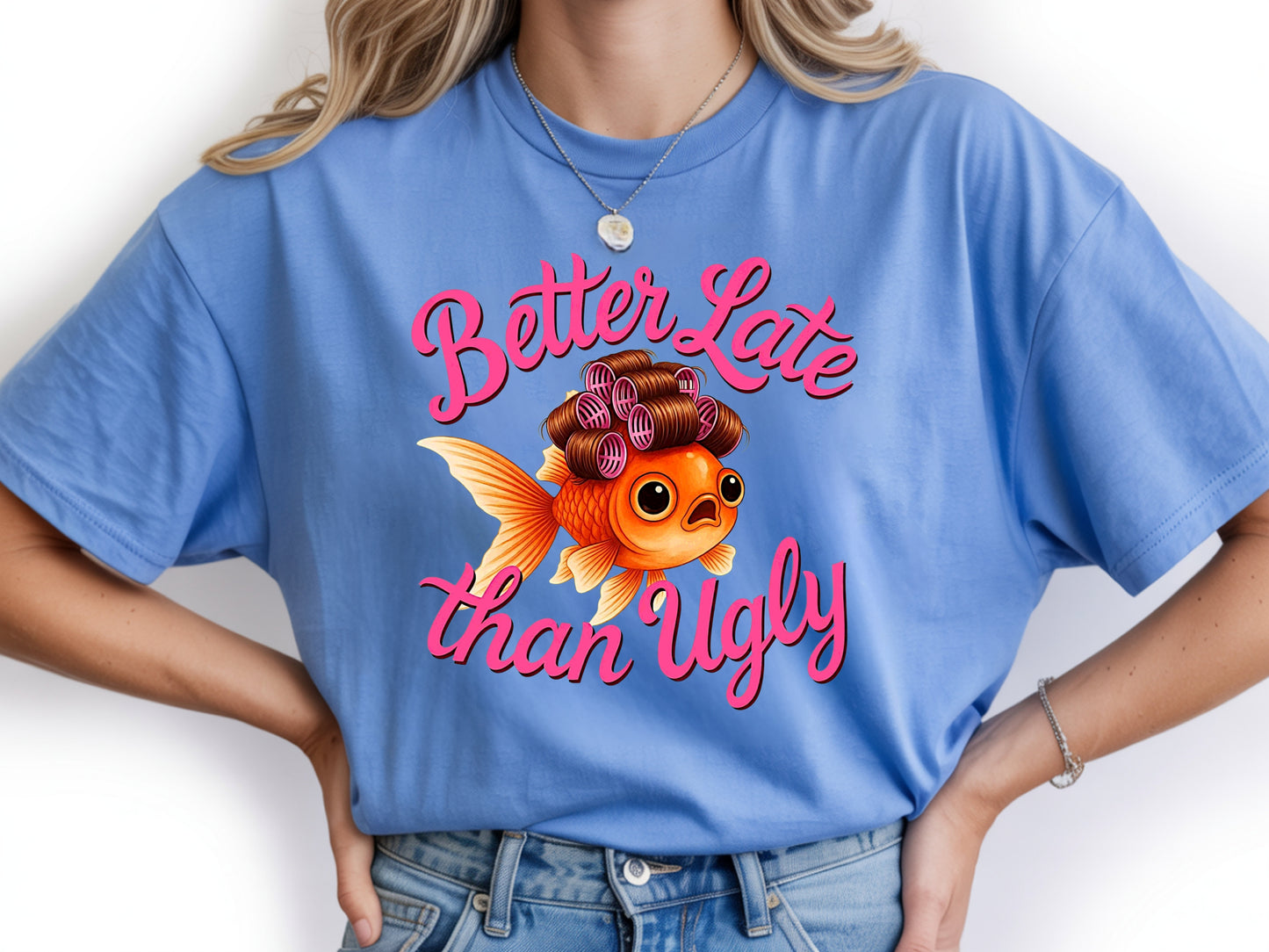 Person wearing blue unisex cute fish t shirt with “Better Late Than Ugly” sarcastic quote and glam goldfish design