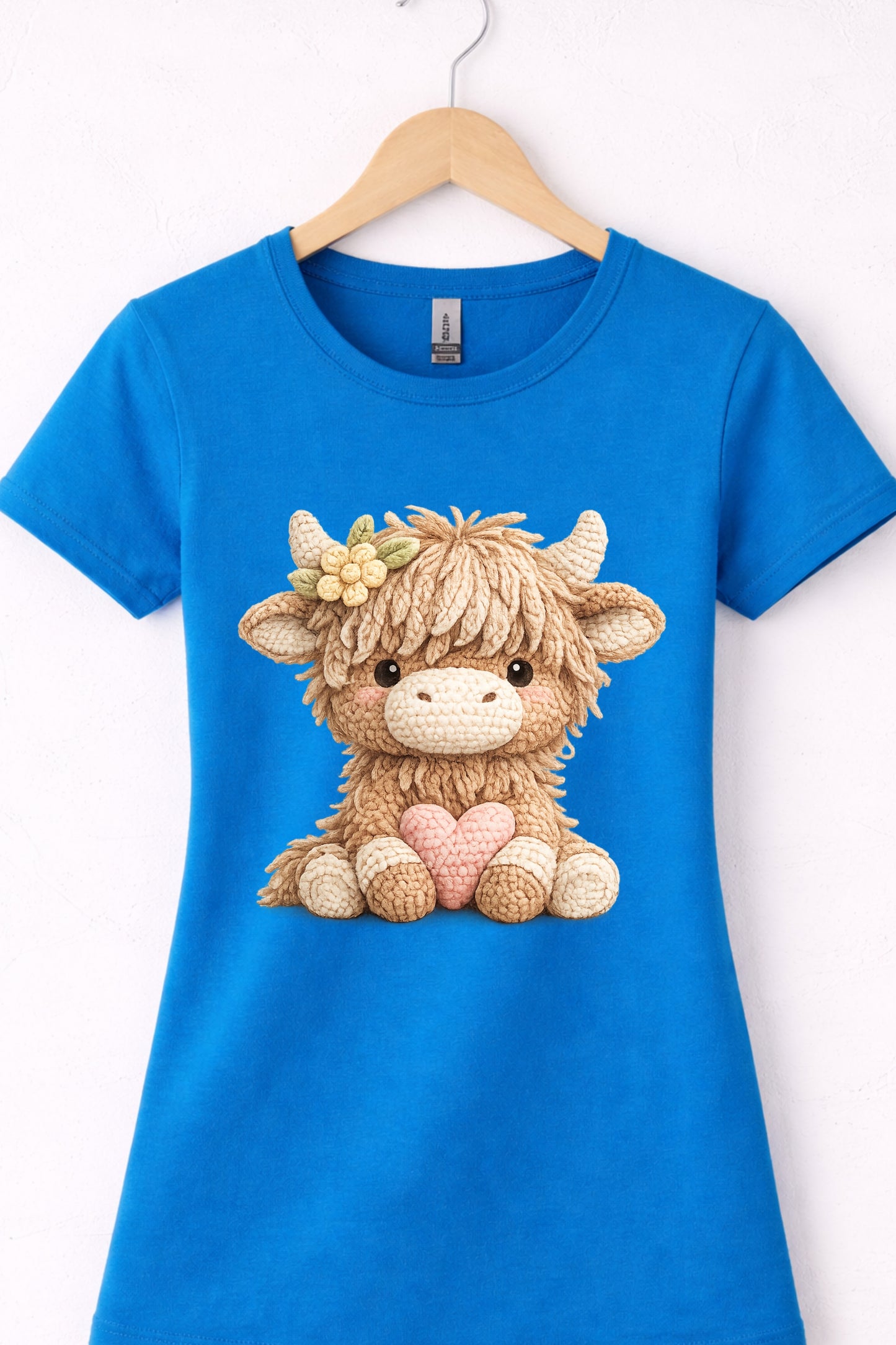 Women’s blue crewneck highland cow t shirt with cute animal cow holding a heart