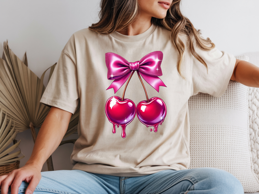 Cherry shirt for women with cute pink bow and cherry graphic on a beige unisex tshirt. 