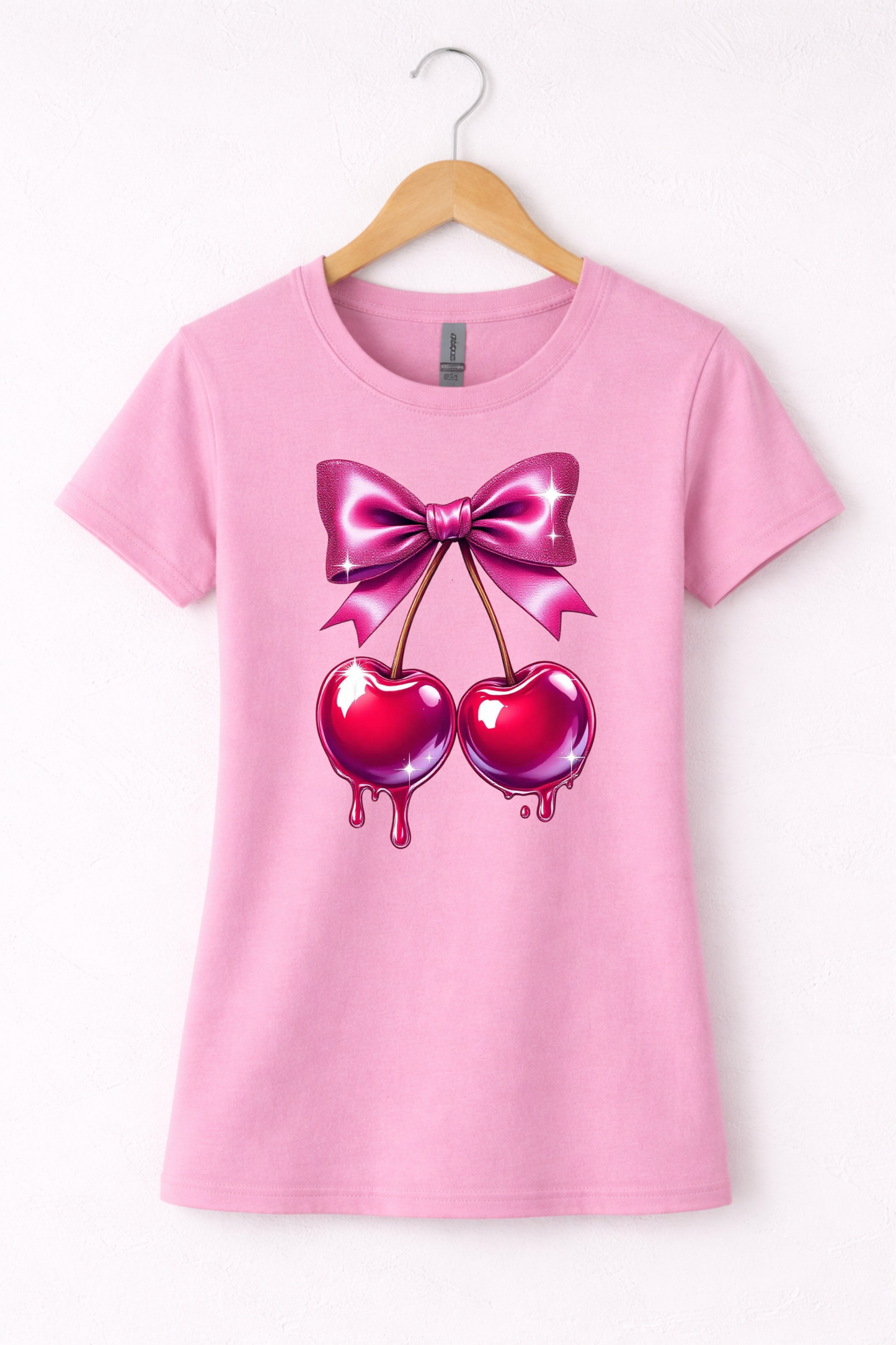 Cherry shirt for women with cute pink bow and cherry graphic on a pink women's crewneck tshirt.