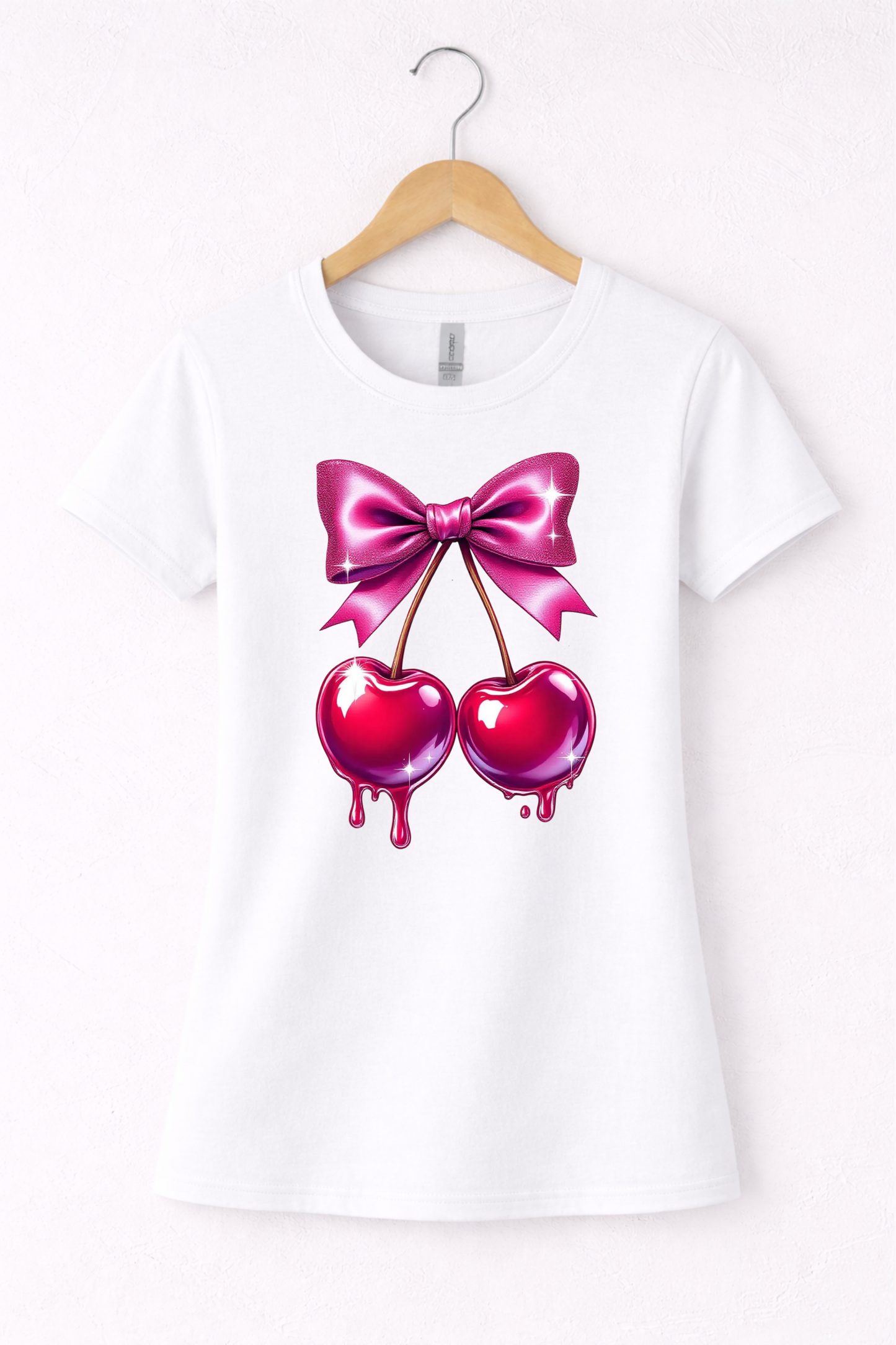 Cherry shirt for women with cute pink bow and cherry graphic on a white women's crewneck tshirt.