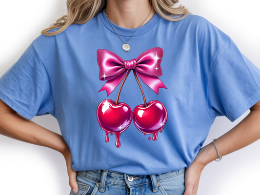 Cherry shirt for women with cute pink bow and cherry graphic on a blue unisex tshirt. 