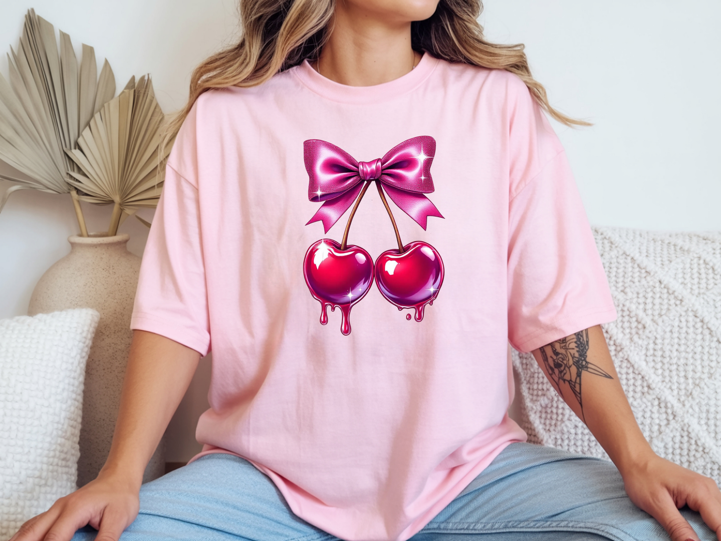 Cherry shirt for women with cute pink bow and cherry graphic on a pink unisex tshirt. 