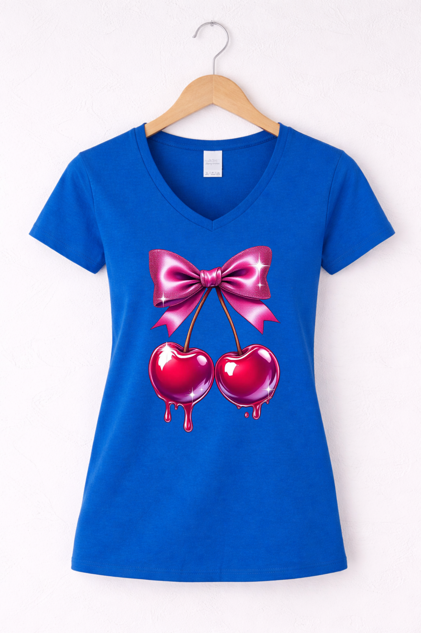 Cherry shirt for women with cute pink bow and cherry graphic on a blue women's v-neck tee.