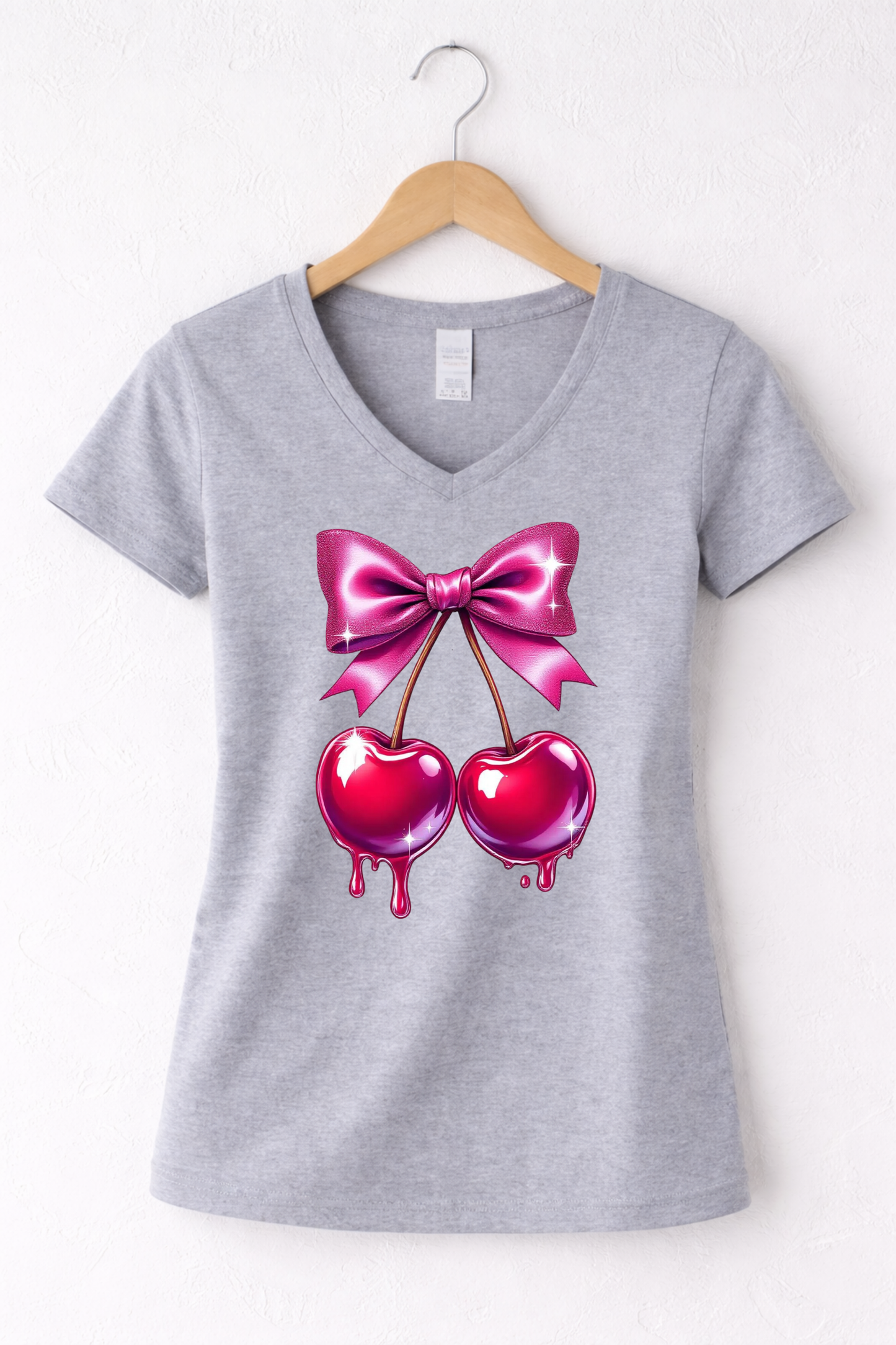 Cherry shirt for women with cute pink bow and cherry graphic on a grey women's v-neck tee.