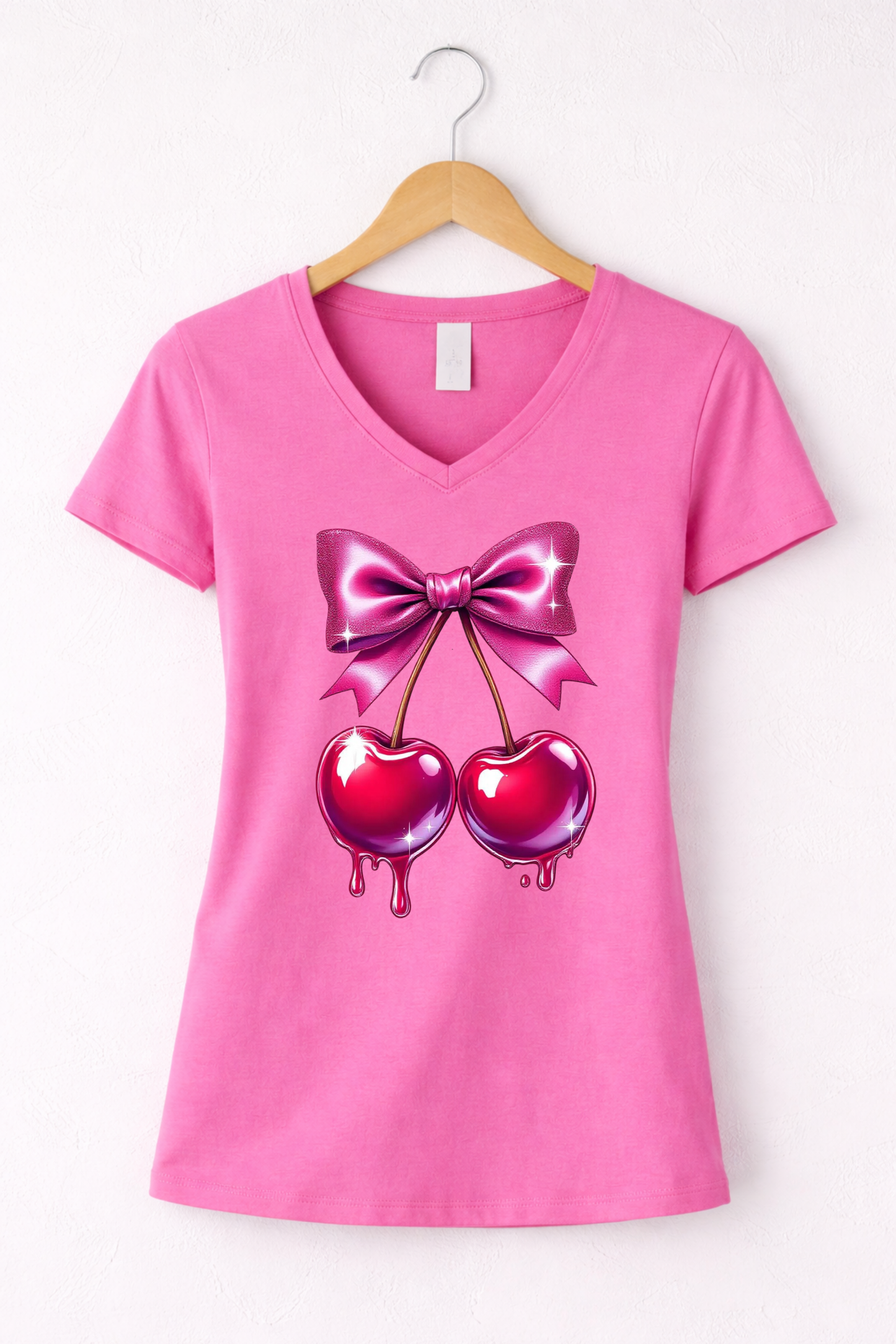 Cherry shirt for women with cute pink bow and cherry graphic on a pink women's v-neck tee.