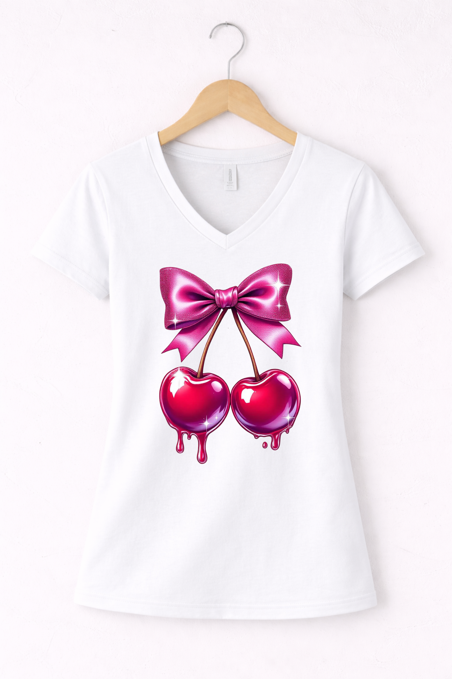 Cherry shirt for women with cute pink bow and cherry graphic on a white women's v-neck tee.