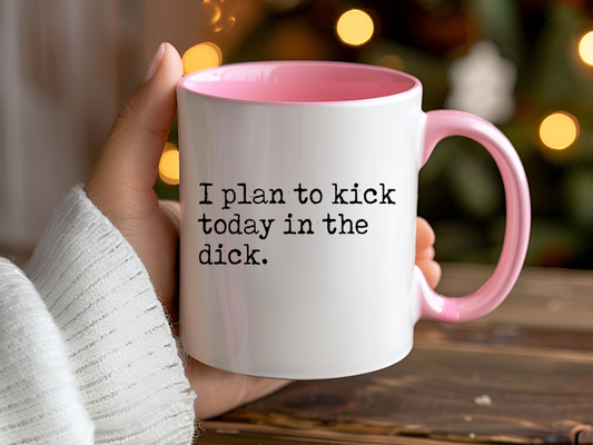 Funny motivational mug with pink handle and interior with “I plan to kick today in the dick” text on the front.