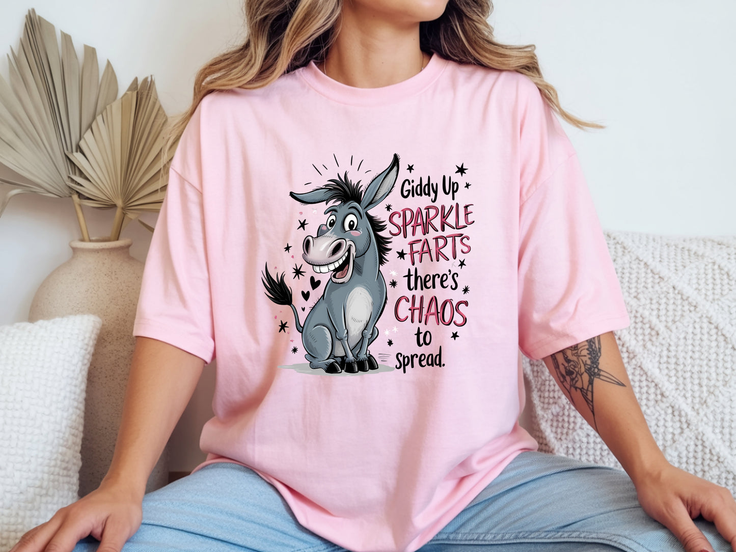 Person wearing pink unisex funny donkey t shirt with sarcastic chaos quote graphic
