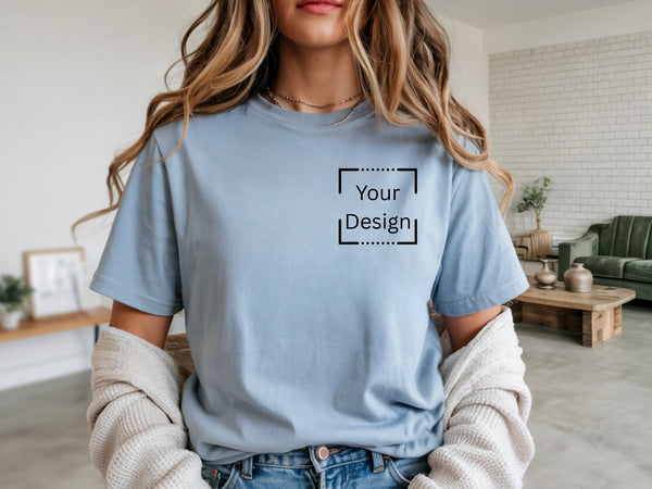Unisex light blue Gildan custom tee shirt with "your design" on the front.