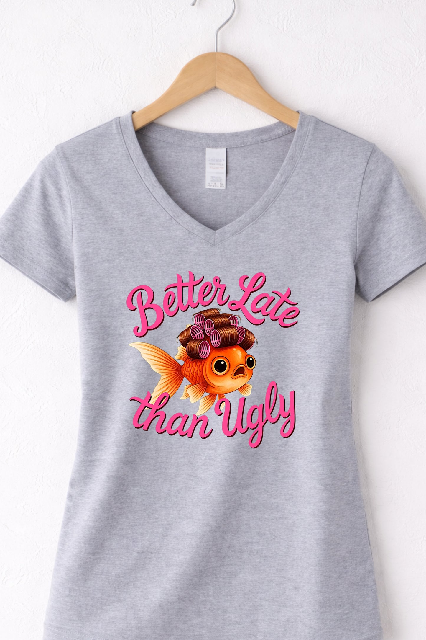 Grey women’s v neck cute fish t shirt featuring glam goldfish and “Better Late Than Ugly” saying