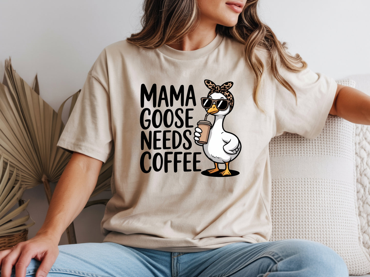 Mama needs coffee shirt with cute "Mama goose needs coffee" text and goose graphic on a beige unisex shirt.