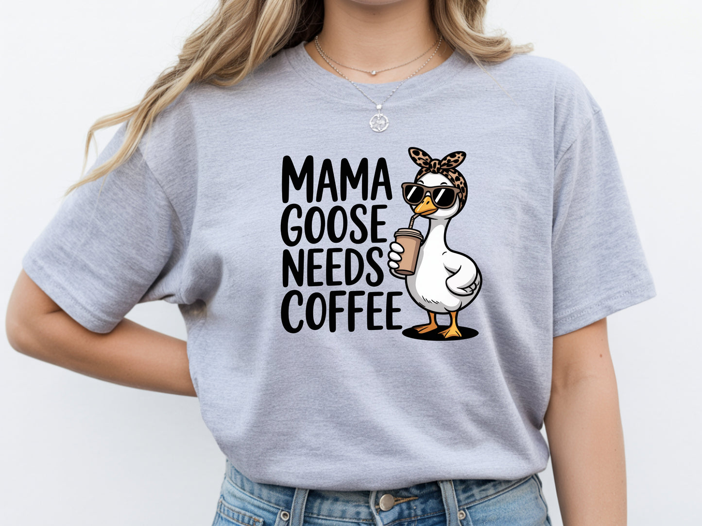 Mama needs coffee shirt with cute "Mama goose needs coffee" text and goose graphic on a grey unisex shirt.