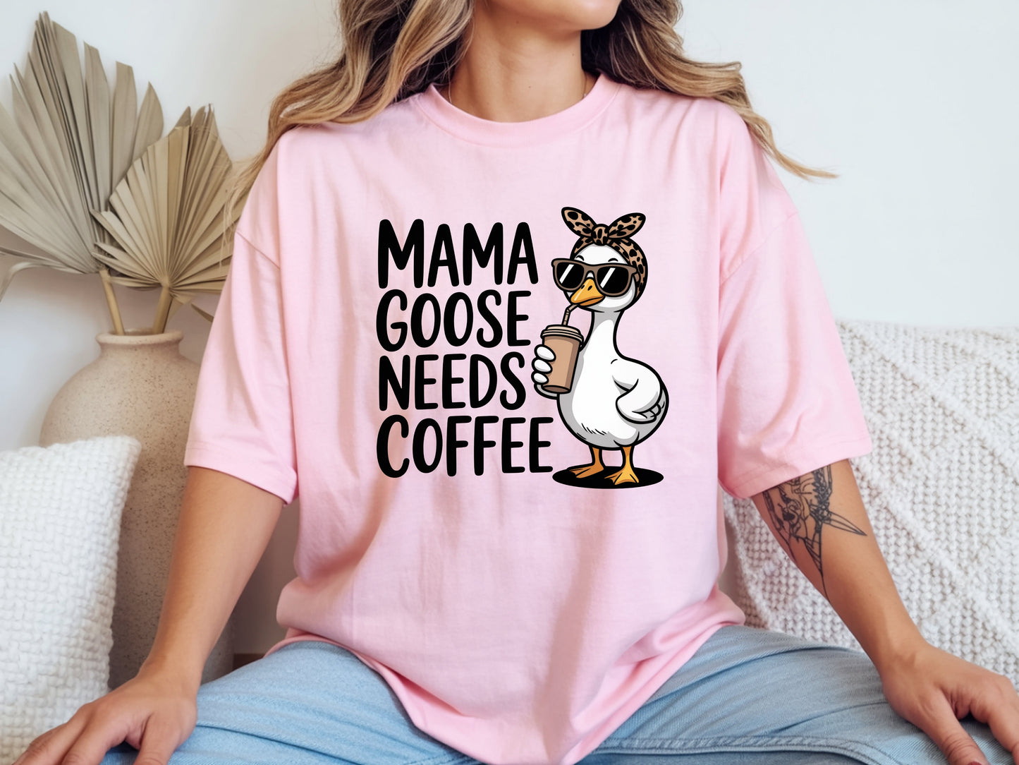 Mama needs coffee shirt with cute "Mama goose needs coffee" text and goose graphic on a pink unisex shirt.
