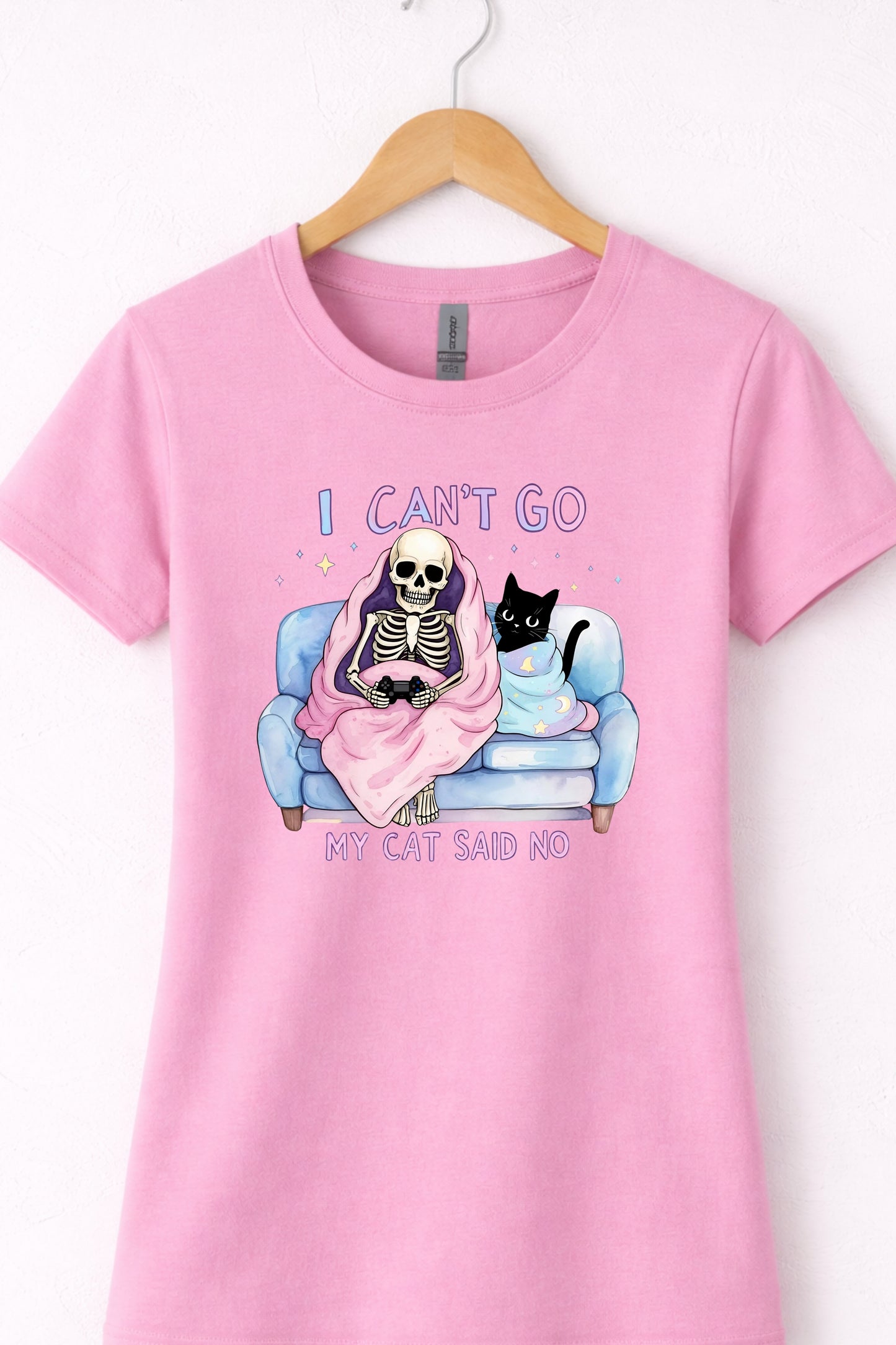 Pink women’s crewneck cat lover graphic tee with skeleton and “I Can’t Go My Cat Said No” design