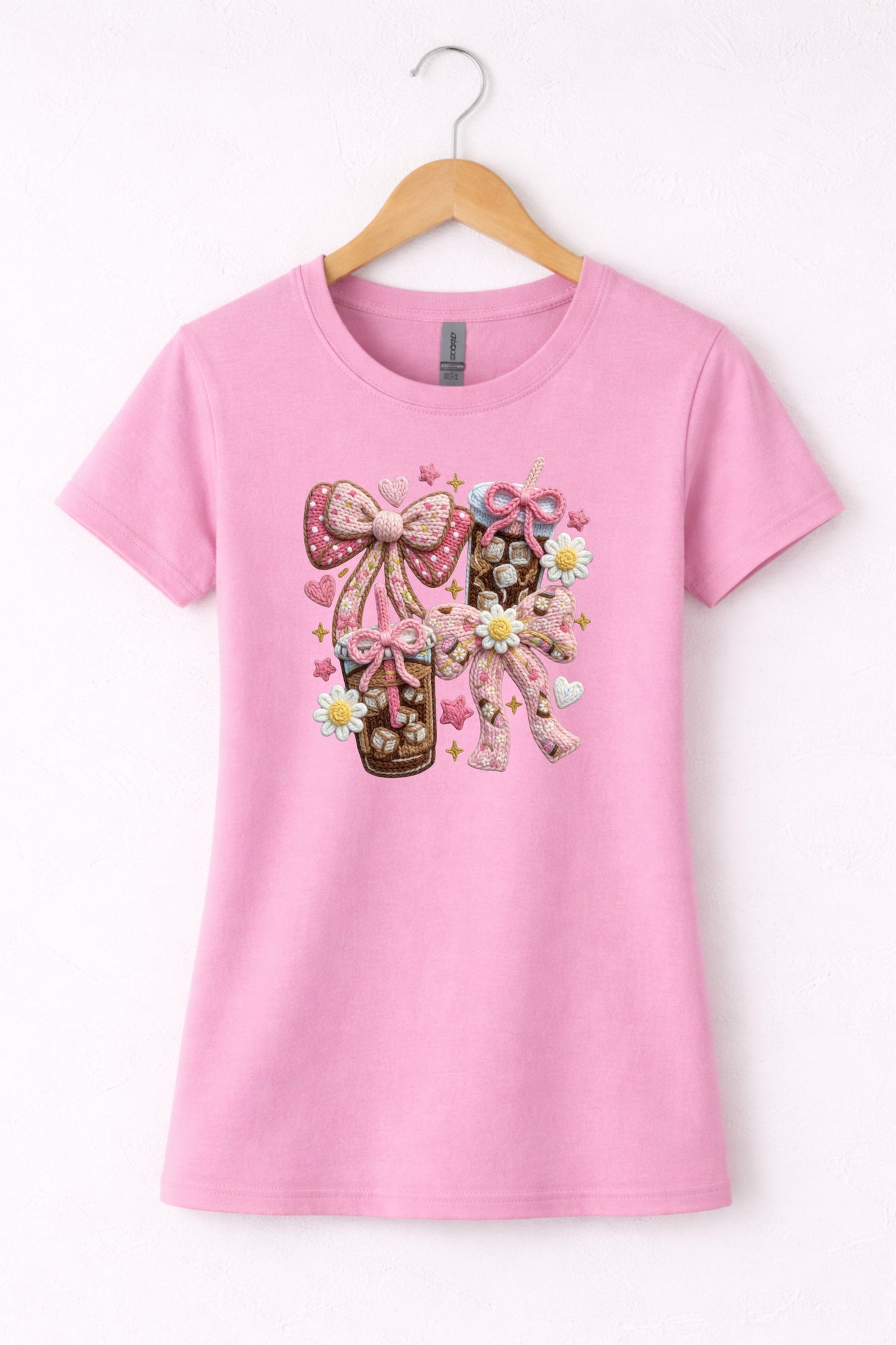 Pink women’s crew neck iced coffee t shirt with coquette style bow coffee design