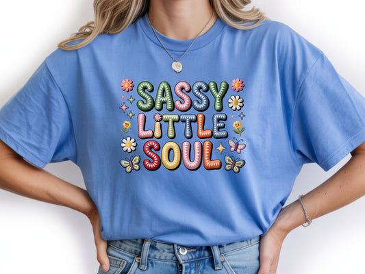 Sassy little soul shirt with cute flower and butterfly graphics and "Sassy little soul" text on a blue unisex tshirt.