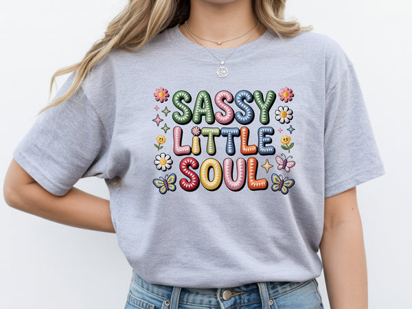 Sassy little soul shirt with cute flower and butterfly graphics and "Sassy little soul" text on a grey unisex tshirt.