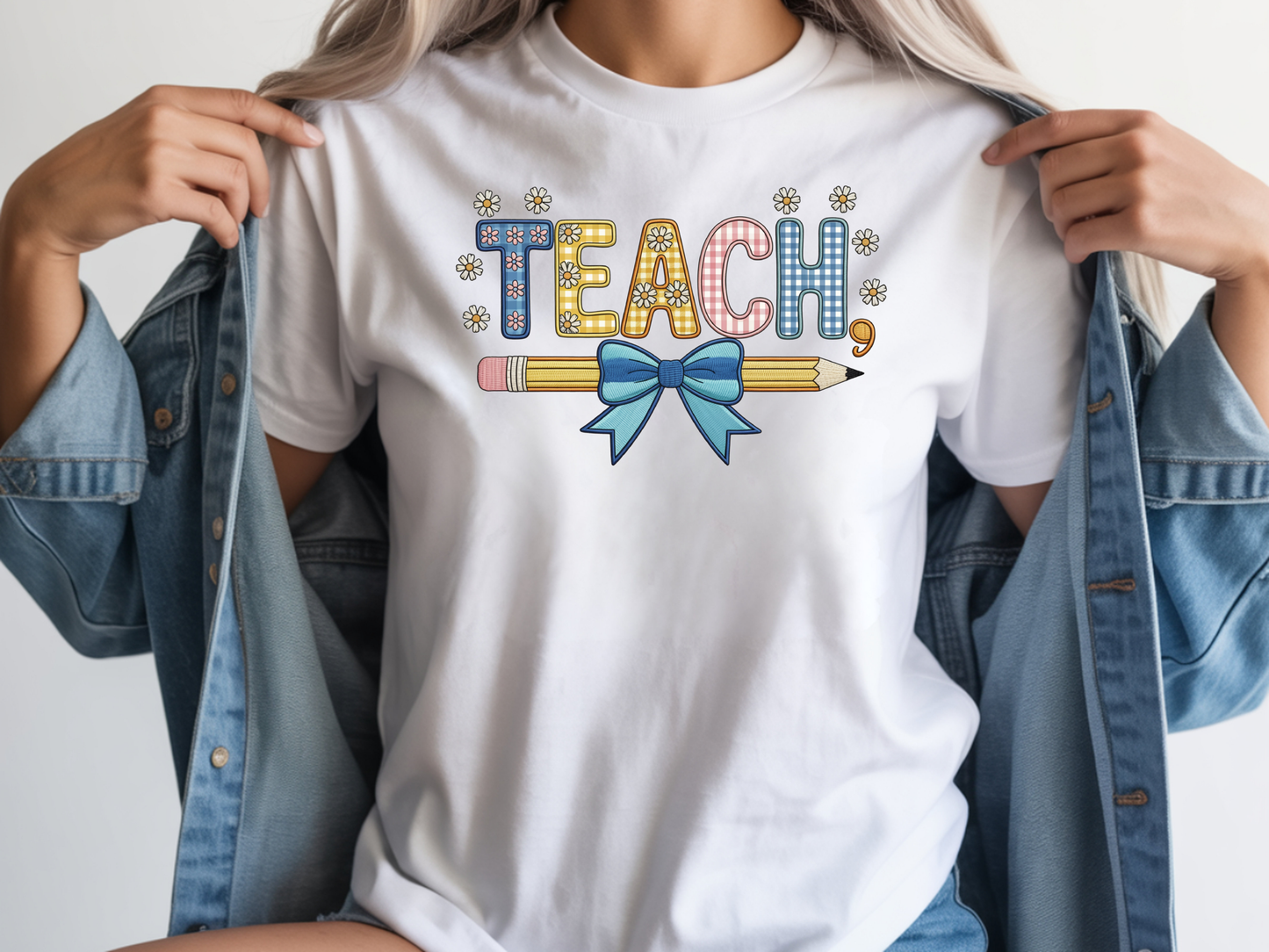 Teacher shirt for women with a cute pencil with blue bow graphic and "Teach" text on a white unisex tee.