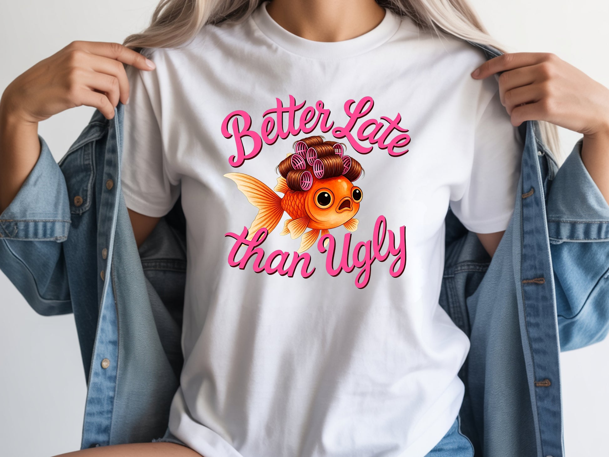 Person wearing white unisex cute fish t shirt with “Better Late Than Ugly” sarcastic quote and glam goldfish design