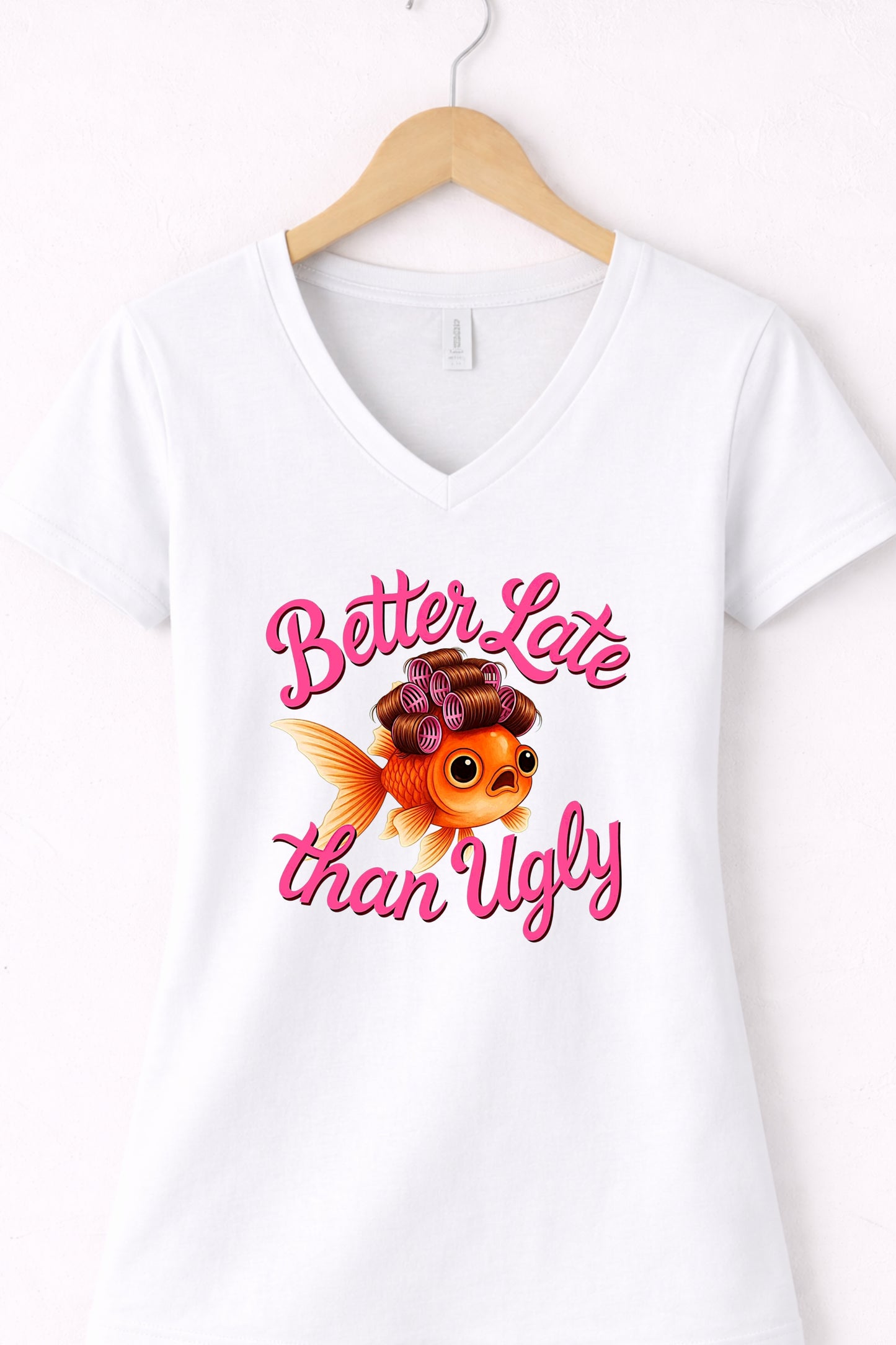 White women’s v neck cute fish t shirt featuring glam goldfish and “Better Late Than Ugly” saying