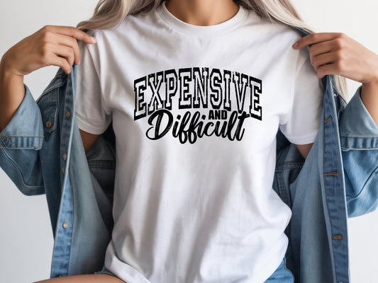 Person wearing white unisex expensive and difficult shirt with bold “Expensive and Difficult” statement graphic